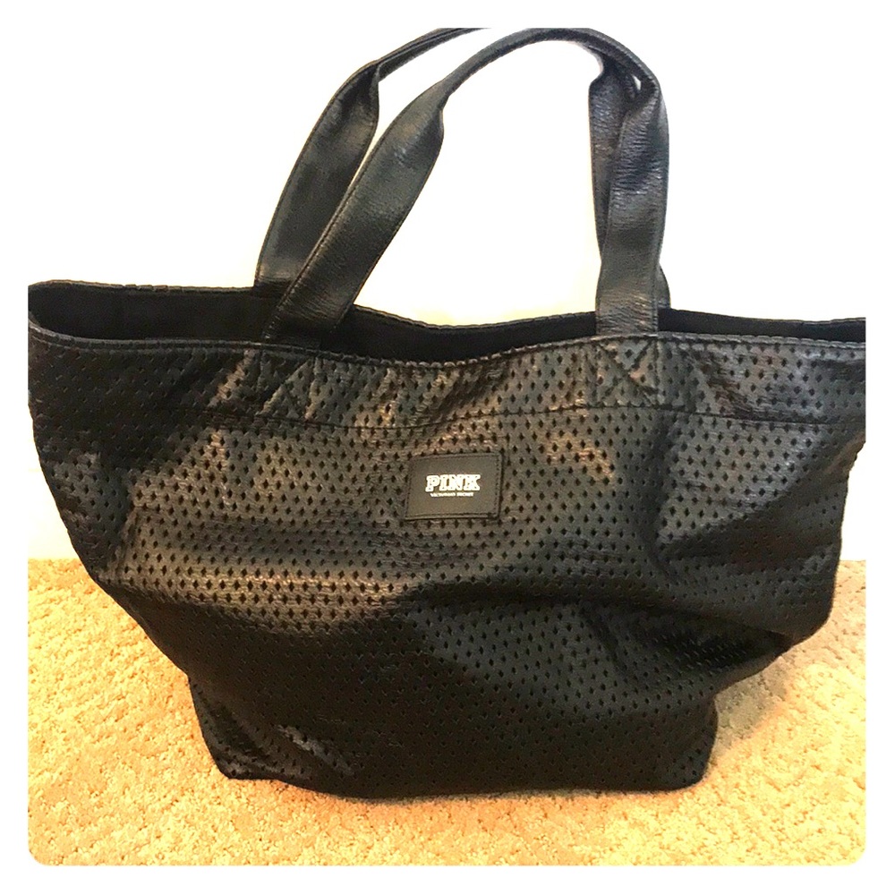 Black perforated Victoria’s Secret tote bag.